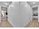 Bright hallway with hardwood floors and views to other rooms at 9513 Villa Ridge Dr, Las Vegas, NV 89134