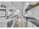 Kitchen with a large island, stainless steel appliances, and golf course views at 9513 Villa Ridge Dr, Las Vegas, NV 89134