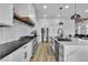 Modern kitchen with stainless steel appliances, white cabinetry, and large island at 9513 Villa Ridge Dr, Las Vegas, NV 89134