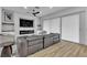 Bright, modern living room with hard wood floors, electric fireplace and updated ceiling fan at 9513 Villa Ridge Dr, Las Vegas, NV 89134