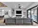 Open living room with fireplace, sliding glass doors and elegant furnishings at 9513 Villa Ridge Dr, Las Vegas, NV 89134