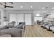 Open-concept living and dining area with contemporary furniture, light-colored floors, and bright natural light at 9513 Villa Ridge Dr, Las Vegas, NV 89134