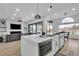 Open living space with kitchen island, golf course views, and cozy living room at 9513 Villa Ridge Dr, Las Vegas, NV 89134