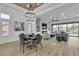 Elegant living space with modern chandelier, wood-look floors, and open layout perfect for entertaining at 9513 Villa Ridge Dr, Las Vegas, NV 89134