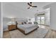 Spacious main bedroom with hardwood floors, a ceiling fan, and a private outdoor access at 9513 Villa Ridge Dr, Las Vegas, NV 89134