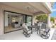 Inviting outdoor patio with comfortable seating, a built-in grill, and seamless indoor-outdoor living at 9513 Villa Ridge Dr, Las Vegas, NV 89134