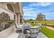 Covered patio featuring comfortable seating with golf course and lush landscaping views at 9513 Villa Ridge Dr, Las Vegas, NV 89134