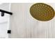 Close-up of a contemporary showerhead with a stylish, minimalist design at 9513 Villa Ridge Dr, Las Vegas, NV 89134