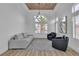 Cozy sitting room features modern decor, wood-look floors, and plenty of natural light at 9513 Villa Ridge Dr, Las Vegas, NV 89134