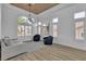 Bright sitting room features stylish seating, wood-look floors, and charming plantation shutters at 9513 Villa Ridge Dr, Las Vegas, NV 89134