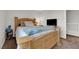 Cozy bedroom with a wood frame bed, soft bedding, and neutral colors at , North Las Vegas, NV 89031