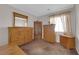 Bedroom with wooden furniture, including dressers and a mirror at , North Las Vegas, NV 89031
