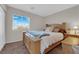 Comfortable bedroom featuring a wood frame bed and serene window view at , North Las Vegas, NV 89031