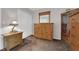 Bedroom featuring natural wood furniture, a sliding-door closet and neutral-colored carpet at , North Las Vegas, NV 89031