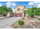 Well-maintained two-story home with a manicured front yard, a spacious driveway, and an attached two-car garage at , North Las Vegas, NV 89031