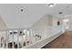 Upstairs hallway overlooking entryway featuring white railing and neutral carpeting at , North Las Vegas, NV 89031