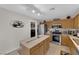 Functional kitchen featuring wood cabinets, stainless steel appliances, and a convenient center island at , North Las Vegas, NV 89031