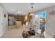 Well-lit eat-in kitchen featuring wood cabinets, stainless steel appliances, and a sliding door to the backyard at , North Las Vegas, NV 89031