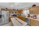 Modern kitchen boasting wood cabinets, stainless steel appliances, and a practical island for meal preparation at , North Las Vegas, NV 89031