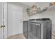 Laundry room with modern washer and dryer set and ample storage space at , North Las Vegas, NV 89031
