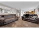 Open-concept living space featuring comfortable sofas and a seamless flow to the dining area at , North Las Vegas, NV 89031