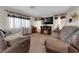 Relaxing living room boasts a fireplace, soft lighting, and stylish window treatments at , North Las Vegas, NV 89031