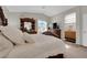 Comfortable main bedroom with bathroom access, a large bed, dresser, and bright window at , North Las Vegas, NV 89031