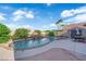 Stunning backyard pool with waterfall, patio, and outdoor seating area at , North Las Vegas, NV 89031