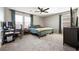 Comfortable bedroom with a queen bed, desk, and windows providing ample natural light at 1023 Brilliant Meadow Ave, North Las Vegas, NV 89086