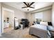 Bedroom showcasing a ceiling fan, window view and a work desk, offering a cozy and functional space at 1023 Brilliant Meadow Ave, North Las Vegas, NV 89086