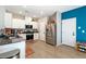 Modern kitchen featuring stainless steel appliances, granite countertops, and stylish white cabinets at 1023 Brilliant Meadow Ave, North Las Vegas, NV 89086