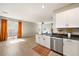 Modern kitchen featuring stainless steel appliances and granite countertops, open to the living space at 1023 Brilliant Meadow Ave, North Las Vegas, NV 89086