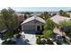 Aerial shot of a single-Gathering home with a well-manicured front yard and driveway at 10791 Silver Lace Ln, Las Vegas, NV 89135