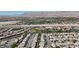 Expansive aerial view showing the neighborhood with a backdrop of scenic mountains and a clear sky at 10791 Silver Lace Ln, Las Vegas, NV 89135
