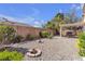 Well-manicured backyard with mature landscaping and a covered patio, creating a private outdoor retreat at 10791 Silver Lace Ln, Las Vegas, NV 89135