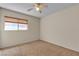 Bedroom featuring neutral tones, carpet, natural light, and a ceiling fan at 10791 Silver Lace Ln, Las Vegas, NV 89135