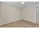Clean bedroom with carpet flooring, ceiling fan, and ample natural light at 10791 Silver Lace Ln, Las Vegas, NV 89135