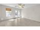 Bedroom featuring tile floors, ceiling fan, french doors to backyard, and window with wood blinds at 10791 Silver Lace Ln, Las Vegas, NV 89135
