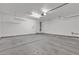 Clean, spacious garage providing parking and storage space, with access door at 10791 Silver Lace Ln, Las Vegas, NV 89135
