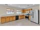 Kitchen features stainless steel appliances and wooden cabinets, offering ample storage and workspace at 10791 Silver Lace Ln, Las Vegas, NV 89135