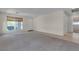 Bright and spacious living room with carpet and tile flooring, a front door and natural light at 10791 Silver Lace Ln, Las Vegas, NV 89135