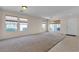 Large living room offers carpet and tile flooring with lots of natural light at 10791 Silver Lace Ln, Las Vegas, NV 89135