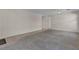 Open living room featuring neutral carpet and tile flooring at 10791 Silver Lace Ln, Las Vegas, NV 89135