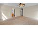 Bright main bedroom with carpet, ceiling fan, walk-in closet and bathroom doorway at 10791 Silver Lace Ln, Las Vegas, NV 89135