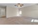 View of the bedroom showing carpet, two windows, and access to a bathroom at 10791 Silver Lace Ln, Las Vegas, NV 89135