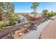 Aerial perspective of the property with a fenced yard, mature trees, and a quiet street at 1088 Casady Hollow Ave, Henderson, NV 89012