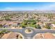 Wide aerial perspective of a residential community with tidy streets and varied homes at 1088 Casady Hollow Ave, Henderson, NV 89012