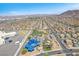 Stunning aerial view of the neighborhood, park, playground and splash pad with beautiful mountain views at 1088 Casady Hollow Ave, Henderson, NV 89012