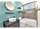 Modern bathroom features a stylish vessel sink and a sleek bathtub with shower at 1088 Casady Hollow Ave, Henderson, NV 89012