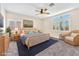 Bedroom with a ceiling fan, carpet floors and a large window at 1088 Casady Hollow Ave, Henderson, NV 89012
